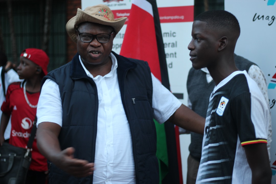 Amb. Joash Maangi, Kenya’s High Commissioner to Uganda with one of the learners.