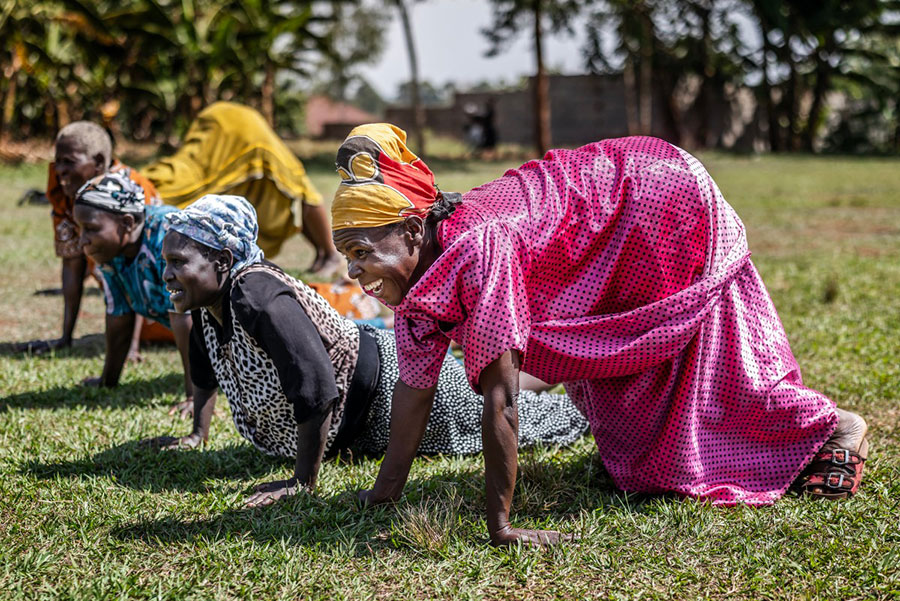 Elderly women, locally known as the &ldquo;cricket grannies&rdquo;, perform exercises and stretches during a cricket and physical training session in Jinja. AFP PHOTO