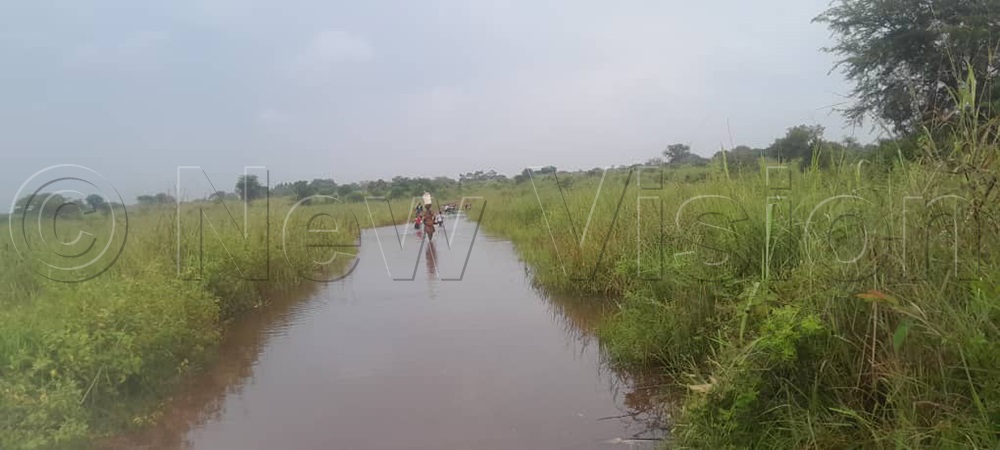 Community access road blocked by floods. (File/New Vision/Christopher Nyeko)