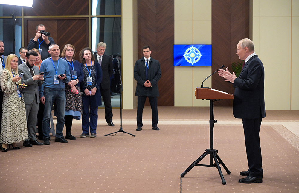 In this pool photograph distributed by the Russian state agency Sputnik, Russia's President Vladimir Putin meets with the Russian media in Bishkek on November 27, 2025. 
