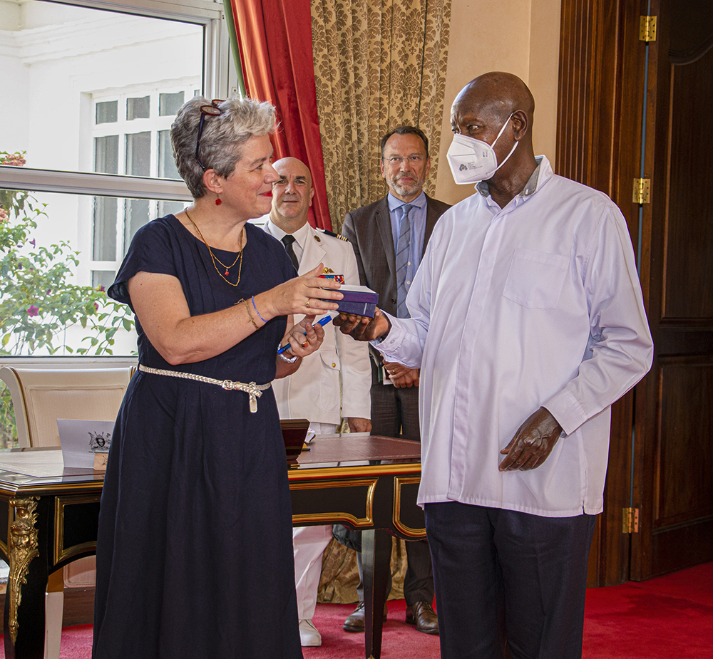 Ambassador Virginie Leroy gifting President Museveni.