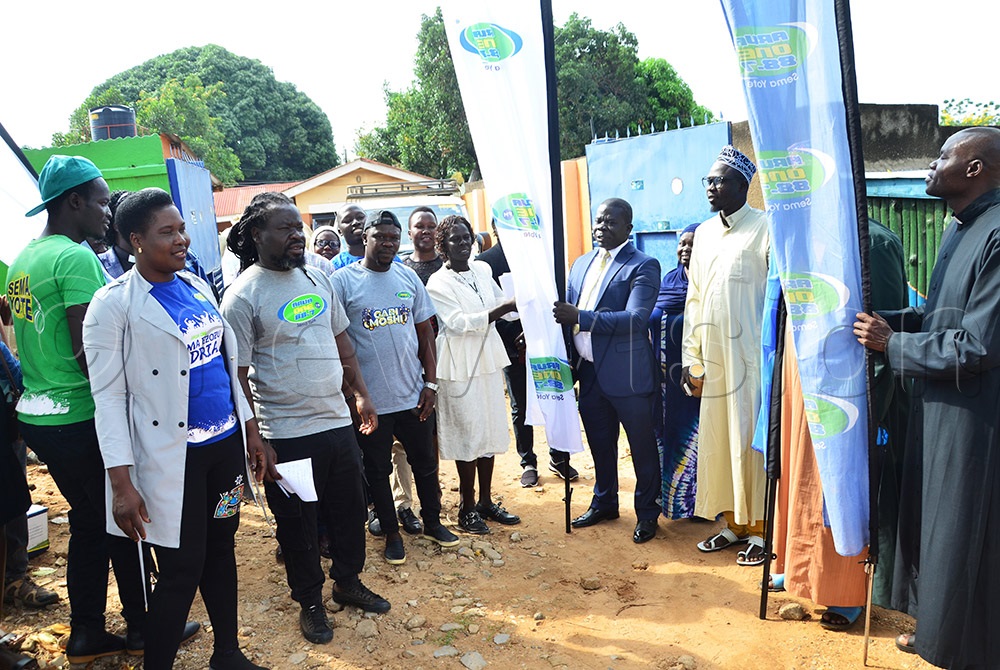 Arua RCC Salim kumakech in suit and religious leaders flagging off the donated items to Rhino Camp Refugee Settlement. (Photo by John Paul Opio)