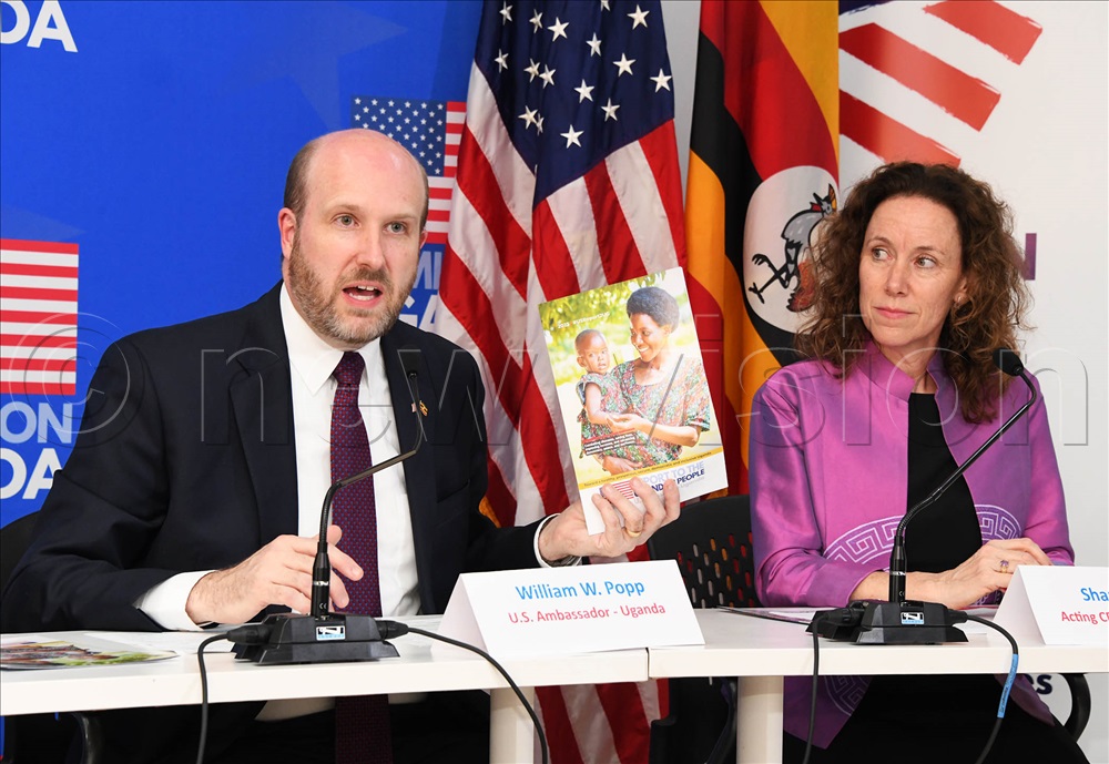 H.E William W. Popp, the U.S Ambassador to Uganda (left) with Sharon Daves Acting CDC Country Director during the launch of the seventh edition of the 'Report to the Ugandan People' A report which provides a review of U.S funded assistance programs in Uganda and their impacts. This is at the American Center in Kampala on Monday.