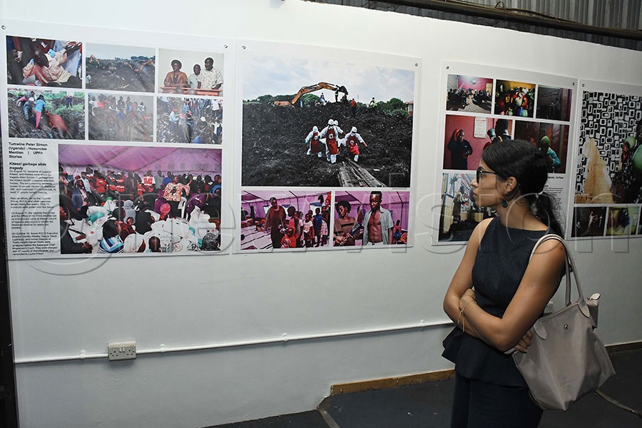 A lady admiring the incredible effort that New Vision's Simon Peter Tumwine. Photo by Ignatius Kamya