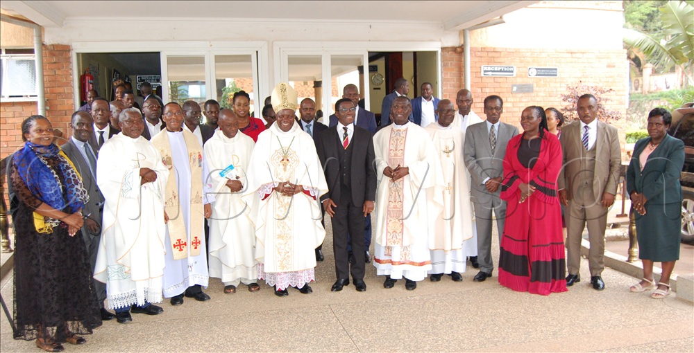 The Bishop of Masaka Diocese, Rt. Rev. Serverus Jjumba (wearing a mitre) shares a photo-moment with the Katikkiro of Buganda, Charles Peter Mayiga (wearing a black suit) and other dignitaries that graced the memorial mass for the late  Hon. Chief Justice Benedicto Kiwanuka at Pope Paul Memorial Hotel in Lubaga. 