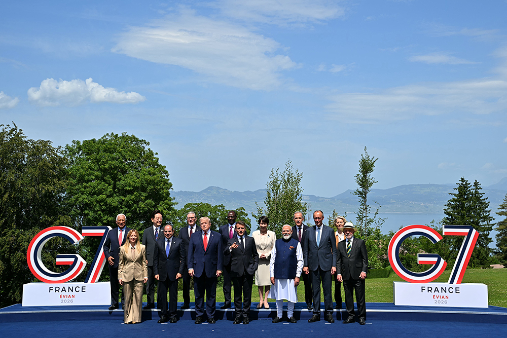 European Council President Antonio Costa, Italy's Prime Minister Giorgia Meloni, South Korea's President Lee Jae Myung, Egypt's President Abdel Fattah El-Sisi, Britain's Prime Minister Keir Starmer, US President Donald Trump, Kenya's President William Ruto, France's President Emmanuel Macron, Japan's Prime Minister Sanae Takaichi, India's Prime Minister Narendra Modi, Canada's Prime Minister Mark Carney, Germany's Chancellor Friedrich Merz, European Commission President Ursula von der Leyen and Brazilian politician Luiz Inacio Lula Da Silva pose for a family photograph during the G7 summit, in Evian, eastern France, on June 16, 2026. (AFP)