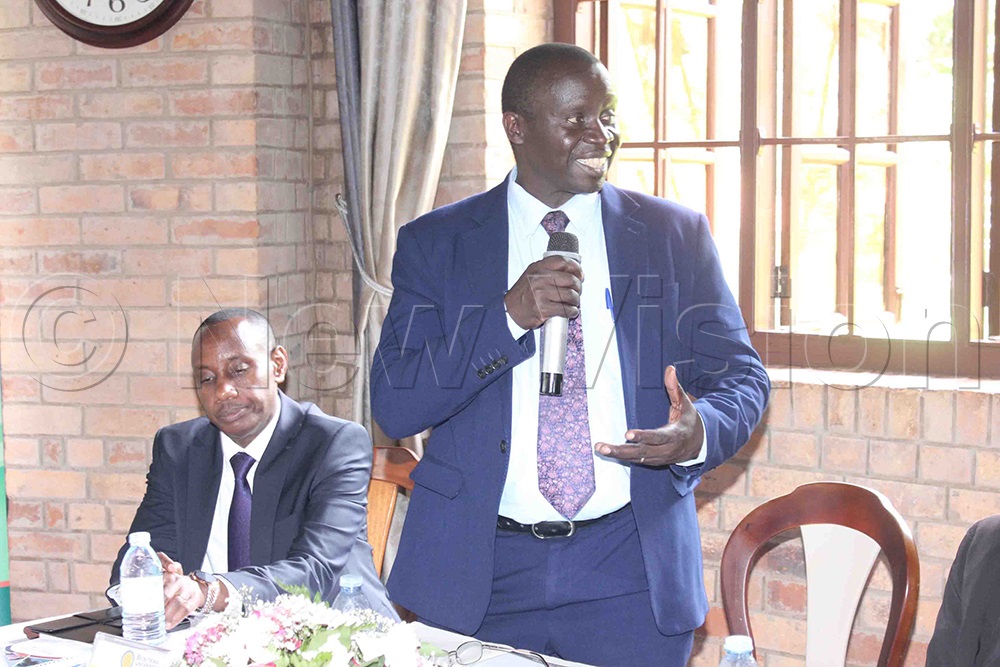 Chairperson of the Uganda Vice Chancellors’ Forum and Vice Chancellor of Busitema University, Prof. Paul Wako, addresses the meeting. Left, Prof. Aaron Mushengyezi, Vice Chancellor of UCU, looks on. (Photo by Henry Nsubuga)