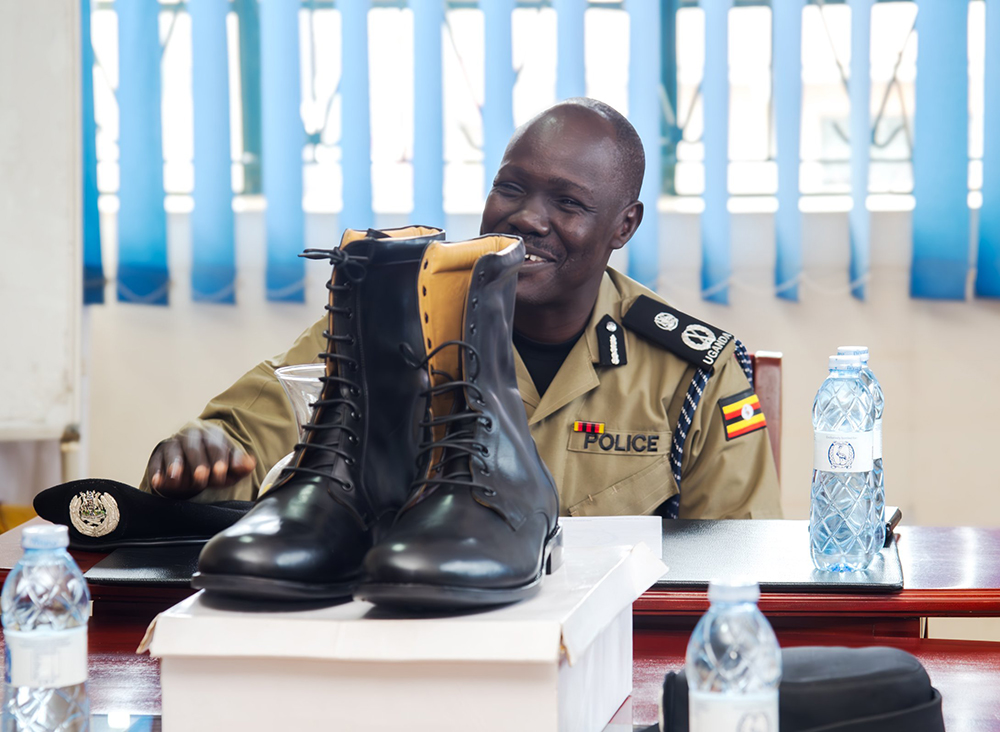 AIGP James Apora, the Director of Logistics and Engineering displaying PPC Jovian Olepus' new pair of boots.