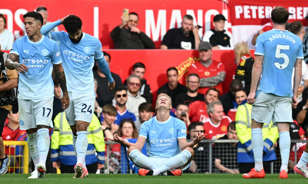 Manchester City's Norwegian striker #09 Erling Haaland celebrates scoring the team's first goal during the English Premier League football match between Manchester United and Manchester City at Old Trafford in Manchester, north west England, on September 13, 2026.