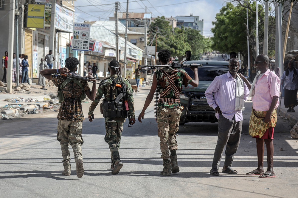 Somali government forces patrol a street as residents gather following reported shelling in the Howl Wadaag district of Mogadishu, on June 4, 2026. (AFP)
