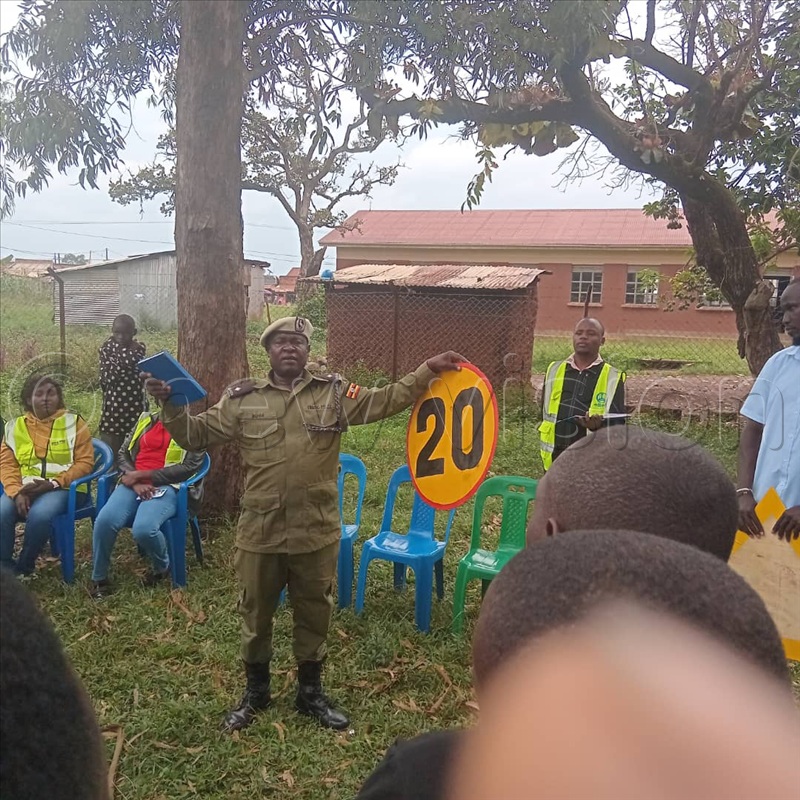 Emmanuel Bumba, the officer in charge of traffic at Kyangwali police station while sensitising the locals