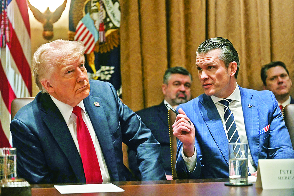US President Donald Trump looks on as Secretary of Defense Pete Hegseth speaks during a cabinet meeting at the White House in Washington, DC, on February 26, 2025. (AFP Photo)