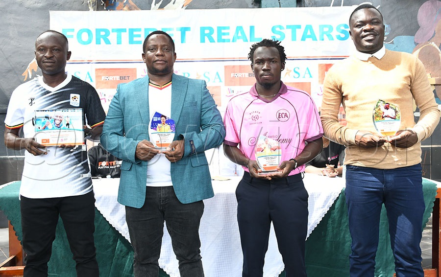Fortebet Real Stars November Awardees Hakim Magumba (left), swimming coach Tonnie Kasujja who represented Gloria Muzito, Bogere's representative Elvis Okakwot and Joseph Cwinyaai pose with their awards at Lazio Restaurant, December 9, 2025. Photo by Michael Nsubuga
