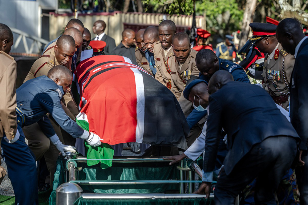 Senior military officials serving as pallbearers carry the coffin of Kenya’s opposition leader and former Prime Minister Raila Odinga during his burial ceremony in Bondo, on October 19, 2025. 