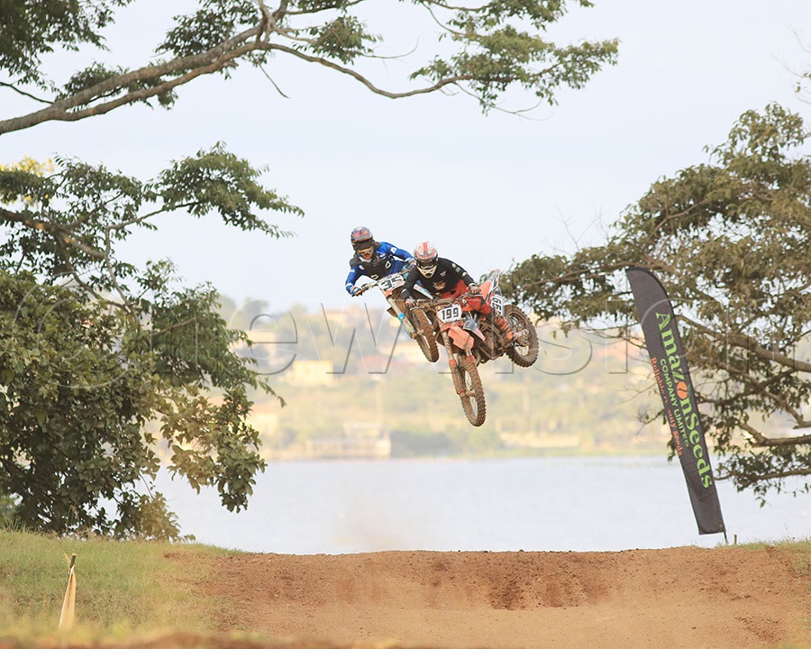 Jerome Mubiru (35) and Miguel Katende (199) battle it our in the MX125cc class during the opening round of the National Motocross Championship in Garuga