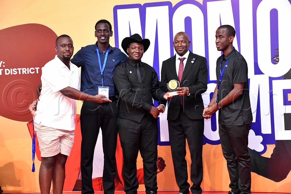 Past District Governor (PDG) Francisco Ssemwanga (forth left) handing over an accolade to Retractors during the 101st District Conference & Assembly at Speke Resort Munyonyo. (Credit: Simon Peter Tumwine) 
