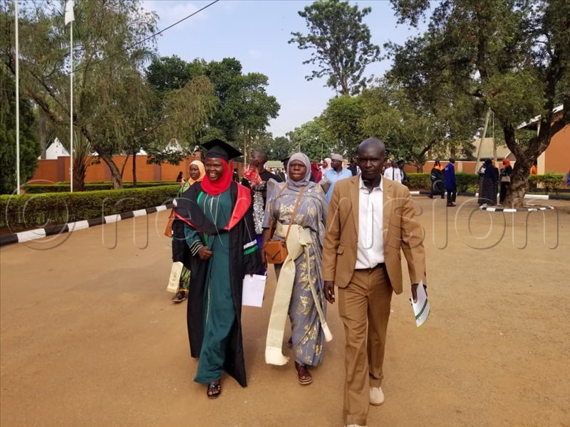 Students and their parents arrive for the ceremony.