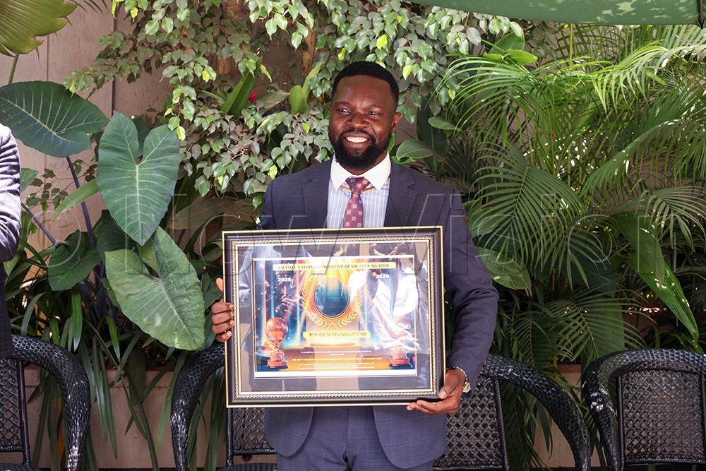 Local entrepreneur Benard Feni, the CEO of EuroGold Refinery, showing his award. (Credit: John Musenze)