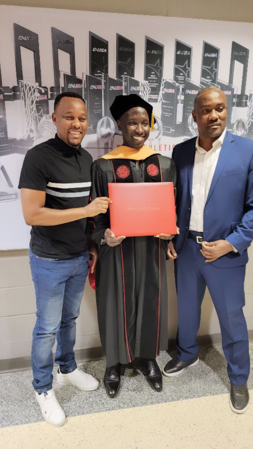 Former Proline captain Musa Mawanda graduates in Medicine (Oncology). Benda (left) and Mujib Kasule attended his graduation. (Courtesy photo)