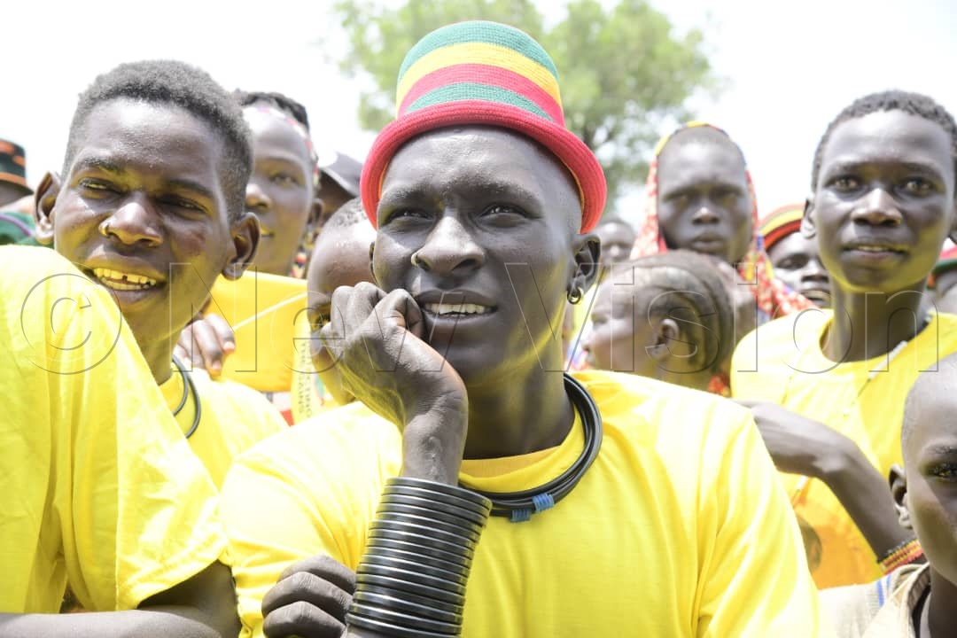 An NRM supporter paying close attention to the president's address while at the campaign rally.