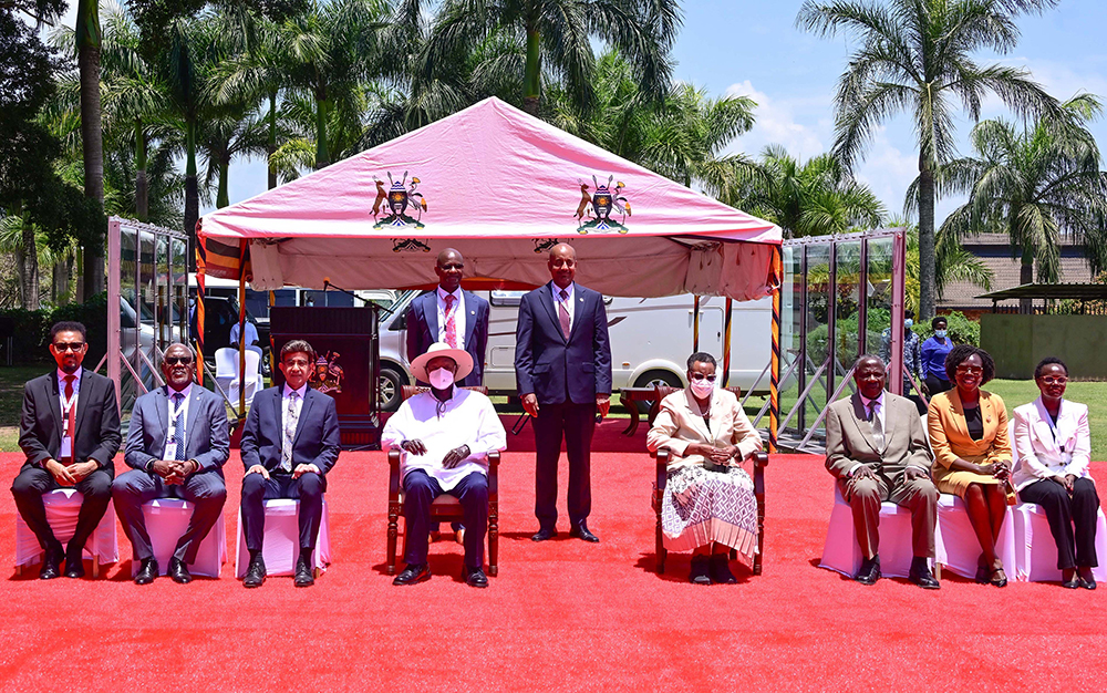 President Museveni (C) and First Lady and Minister of Education and Sports, Janet Museveni, pose for a photo with some of the delegates attending the Uganda Development Finance Summit at Speke Resort Munyonyo on Monday. (PPU Photo)
