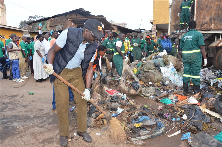 Vision Group Editor in Chief Sidney Miria during a cleaning exercise in Kampala.