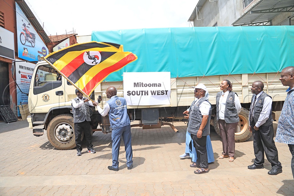 The Electoral Commission chairperson, Justice Simon Byabakama (holding a flag), with other commission members, dispatching the first batch of voting materials at the commission&rsquo;s warehouse in Ntinda, a Kampala suburb, on Thursday, January 8, 2026. (Photo by David Lukiza)
