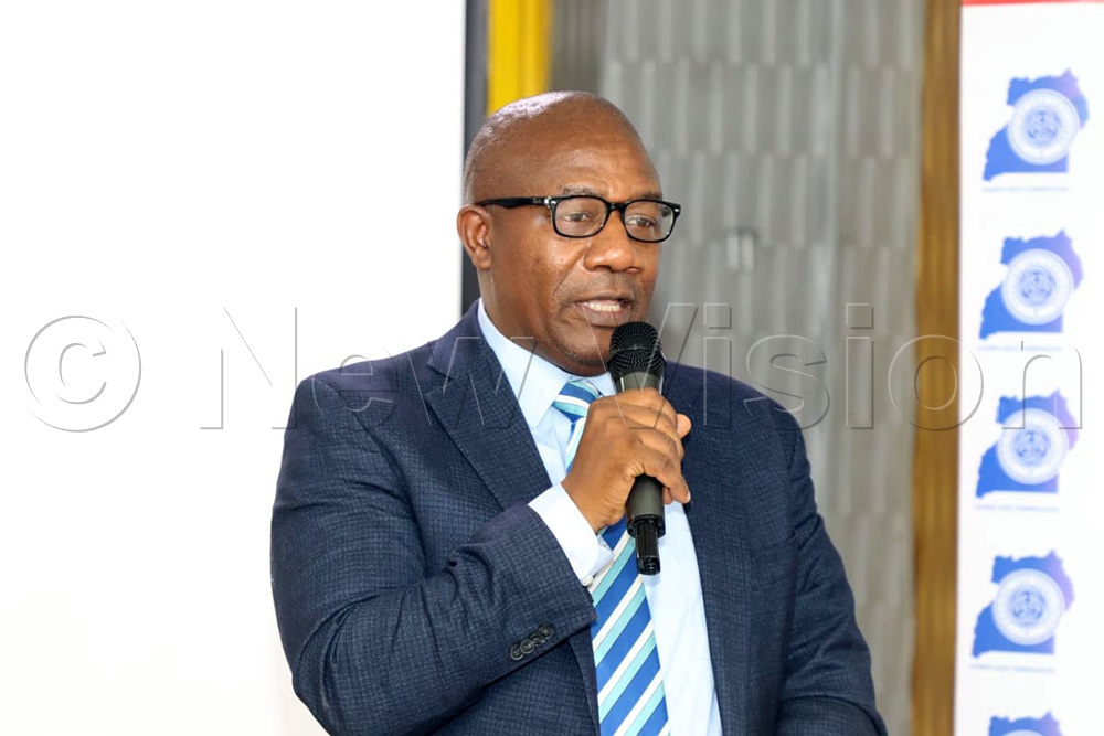 Dr Vincent Bagambe, the Director of Planning and Strategic Information at the Uganda AIDS Commission (UAC), addressing private sector members at Hotel Africana. (Credit: Agnes Kyotalengerire)