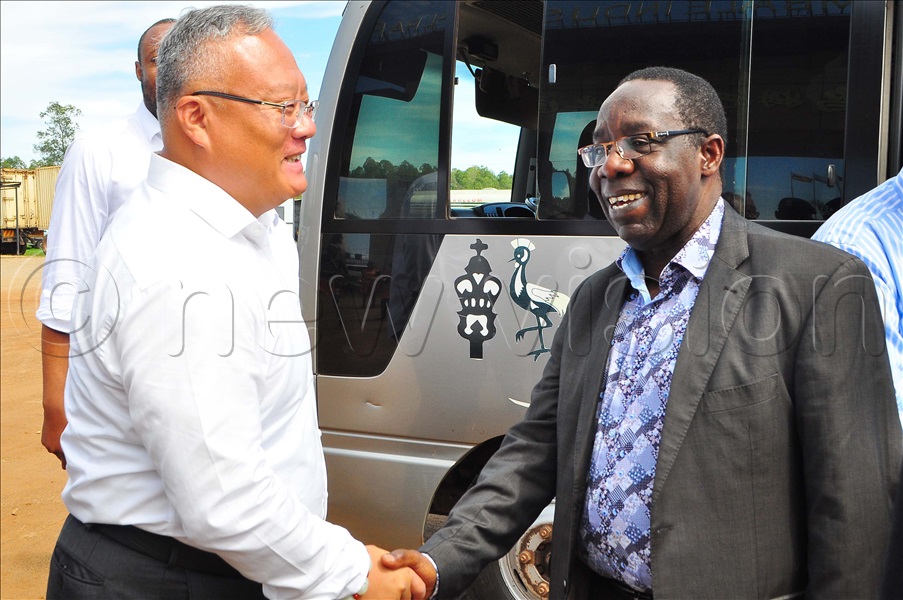 Michael Wang, General Manager, Sino-Uganda Mbale Industrial Park (left) welcomes Dr Keefa Kiwanuka, Chairman, Committee of Finance and Economic Development upon his arrival at Sino-Uganda Mbale Industrial Park on Friday, March 24, 2023. 