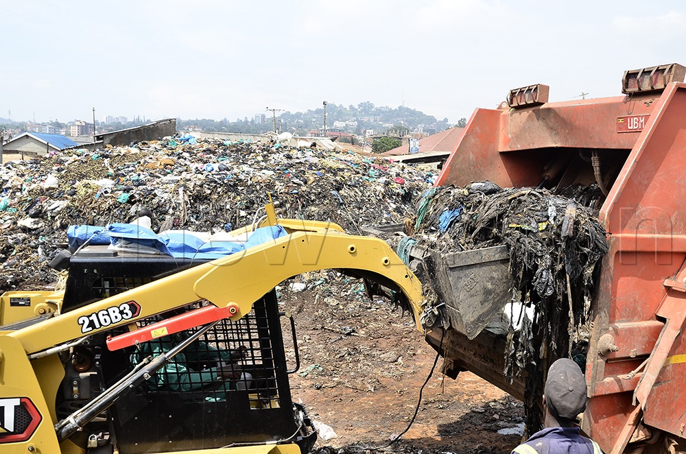 Kampala Capital City Authority (KCCA) mini-tractor loads rubbish from the heap in the background on a garbage truck during Executive Director of KCCA, Sharifah Buzeki’s cleanup exercise at Namuwongo in Makindye division, Kampala on June 6, 2026. (Photo by Ronnie Kijjambu)