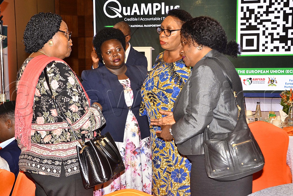 Helen Bugaari (left), Director of Comprehensive Refugee Response Framework Uganda at the Office of the Prime Minister interacting with executive directors during the QuAMplus digital tool at Sheraton Hotel. (Photo by Juliet Kasirye)