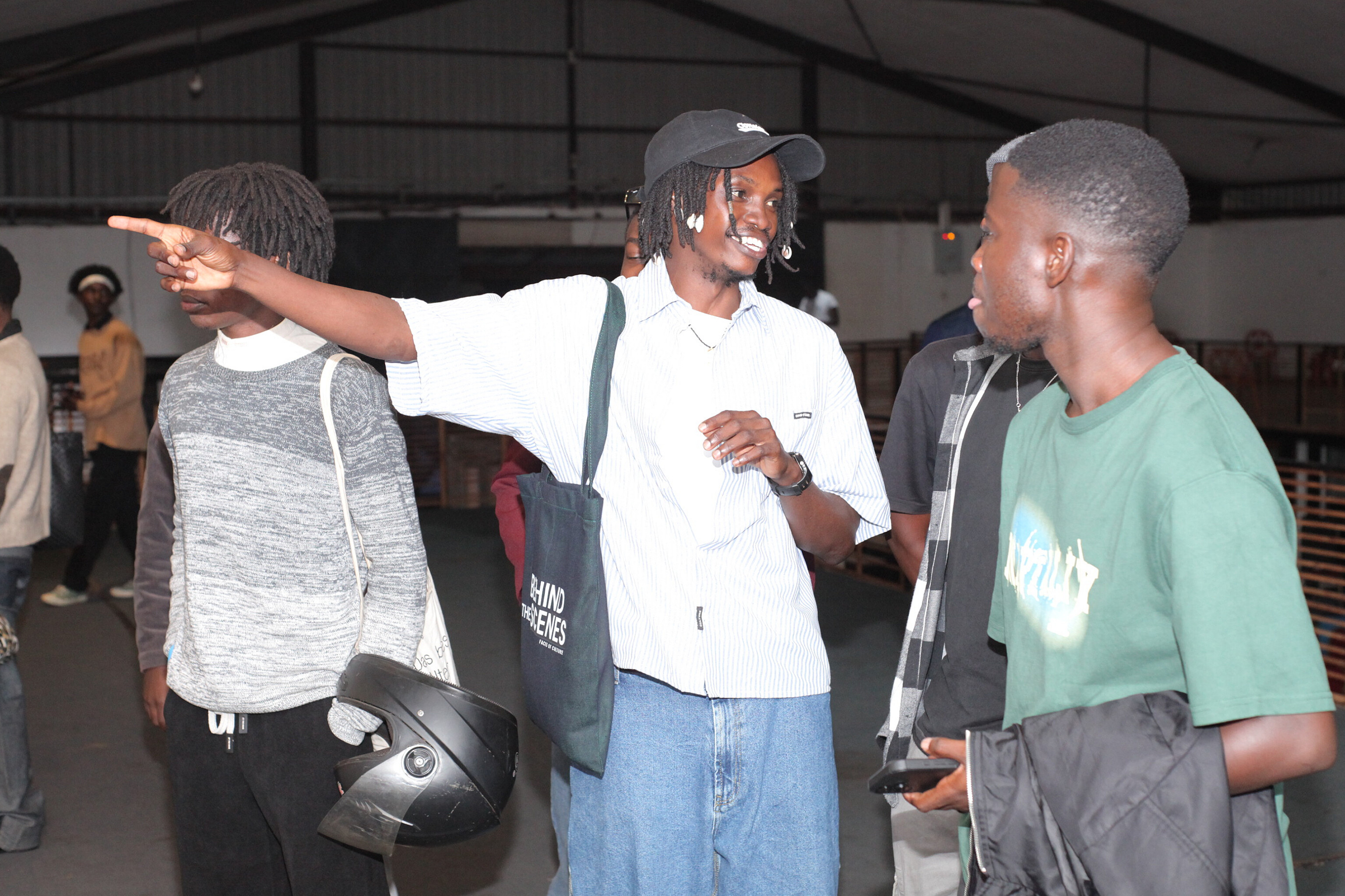 Frank Tumuhairwe Explaining Some Of His Art Pieces To The Attendees At Motiv During His Faces Of Culture Art Exhibition 