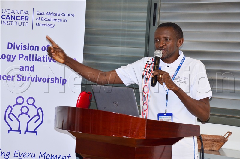 Dr Noleb Mugisha, the head of the survivorship unit addressing participants during the launch.