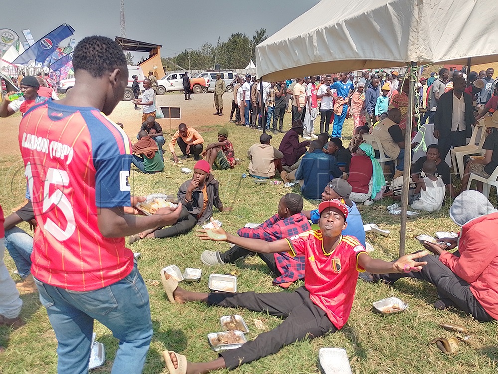 Fans continue to enjoy free meals served by Radio West during the celebrations marking 27 years of great service. (Credit: Abdulkarim Ssengendo)