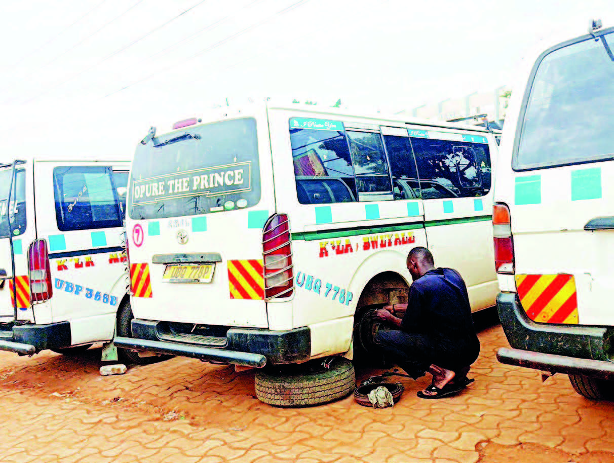 Taxis undergo repairs while waiting for their loading turn at Namboole stage, where loading is done on a first-come, first-served basis