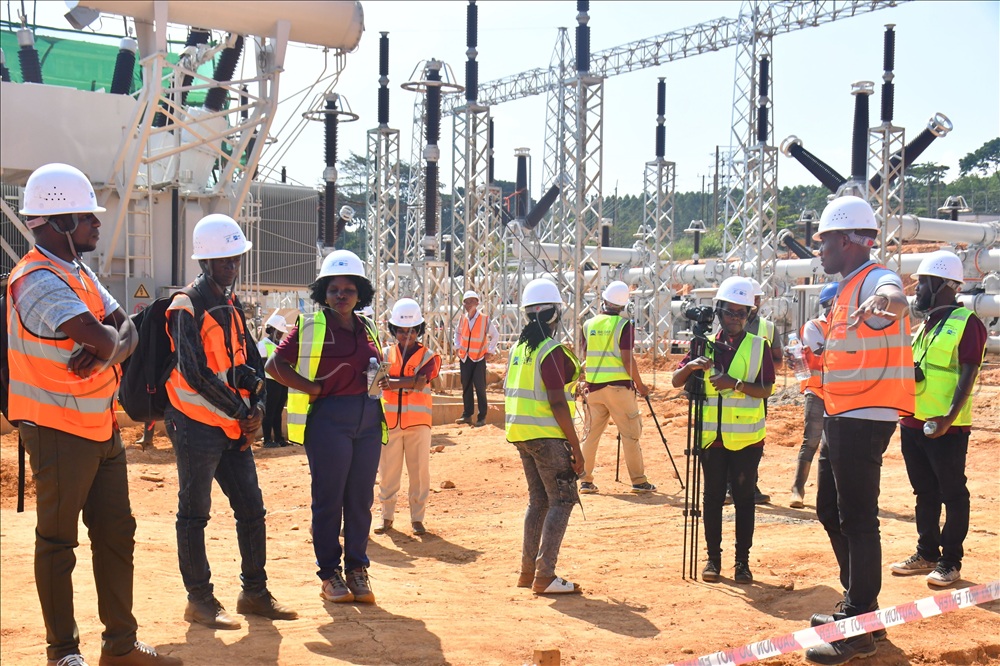 Mark Namungo (right) the Project Manager for the Greater Kampala Metropolitan Area Transmission System Improvement Project explaining construction works progress to journalists and JICA staff, while at the new Mukono power substation on Monday. 
