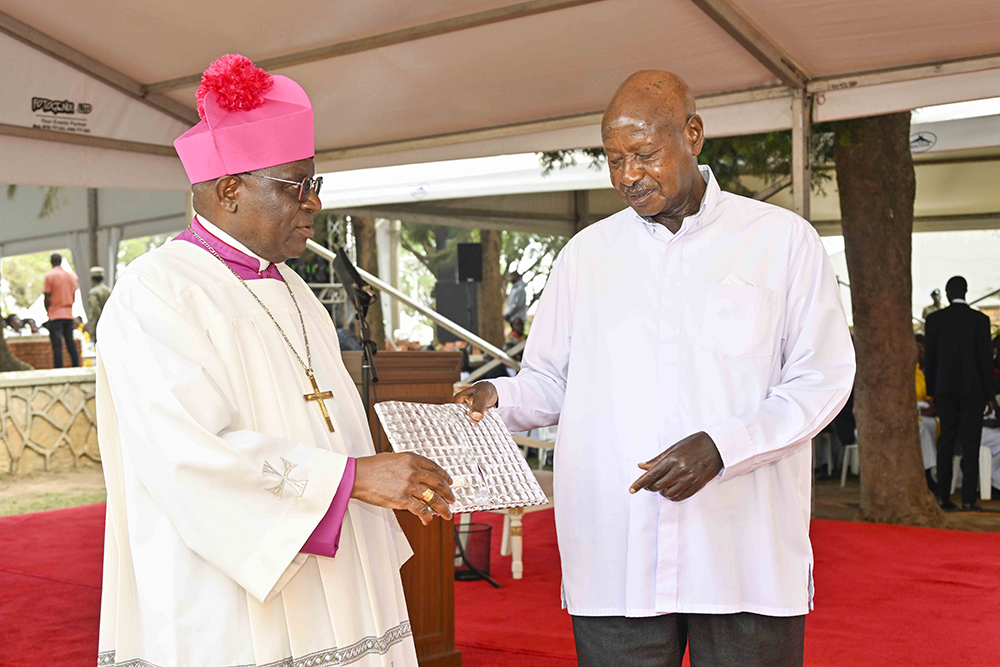 President Yoweri Kaguta Museveni receiving booklet from Archbishop of Kampala Archdiocese Most Rev. Paul Ssemogerere that contains the history of St. Mary’s Cathedral of Lubaga during the Celebrations to mark 100 years of the St. Mary’s Cathedral of Lubaga, which is also Kampala Archdiocese Day on the 26th October 2025.