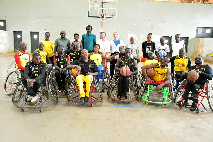 Elite wheelchair basketball players interact with coaches from the United Kingdom at Lugogo Indoor Arena. Photo: Silvano Kibuuka