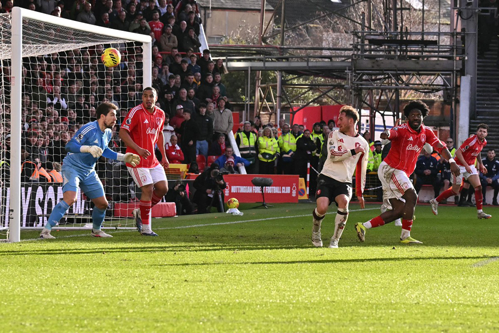 Alexis Mac Allister (2nd R) deflects the ball into the goal, which was ruled a no goal after a VAR check. (Credit: AFP)