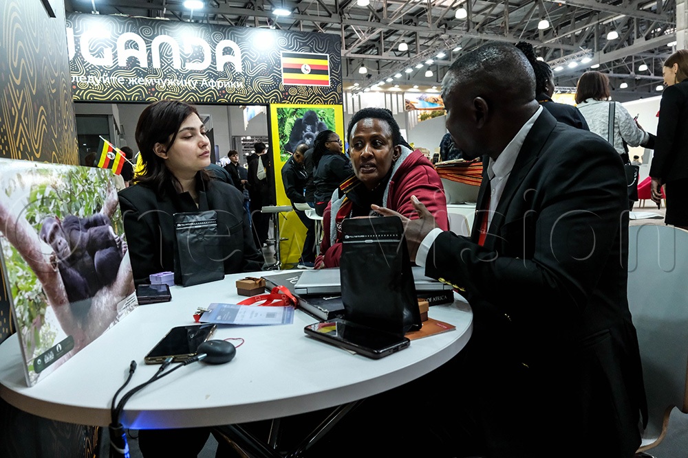 Betty Mbaho Kyasiimire (C) (Representative of Emburara Safaris Lodges) talking to tour operators from Zimbabwe during the Moscow International Travel and Tourism (MITT) Expo in Moscow, on March 11 2026. (Photo by Hajarah Nalwadda)