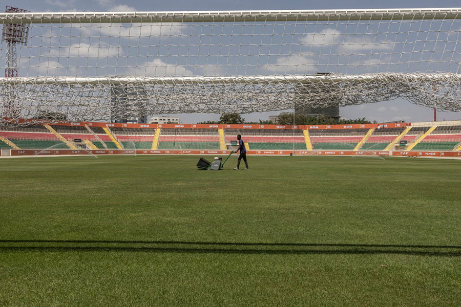 A groundkeeper pulls a wheelbarrow as he applies final touches at the Moi International sports centre Kasarani in Nairobi on July 28, 2025, ahead of the CAF African Nations Championship (CHAN) 2024.AFP PHOTO