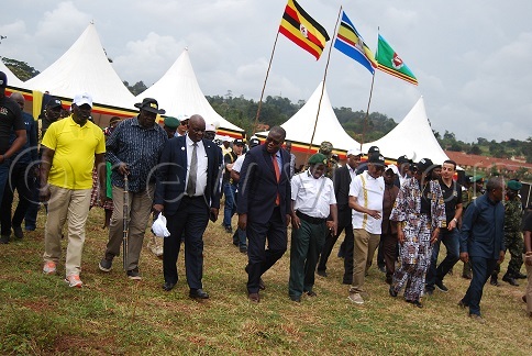 Minister Oboth leads the delegation to the firearms destruction site.