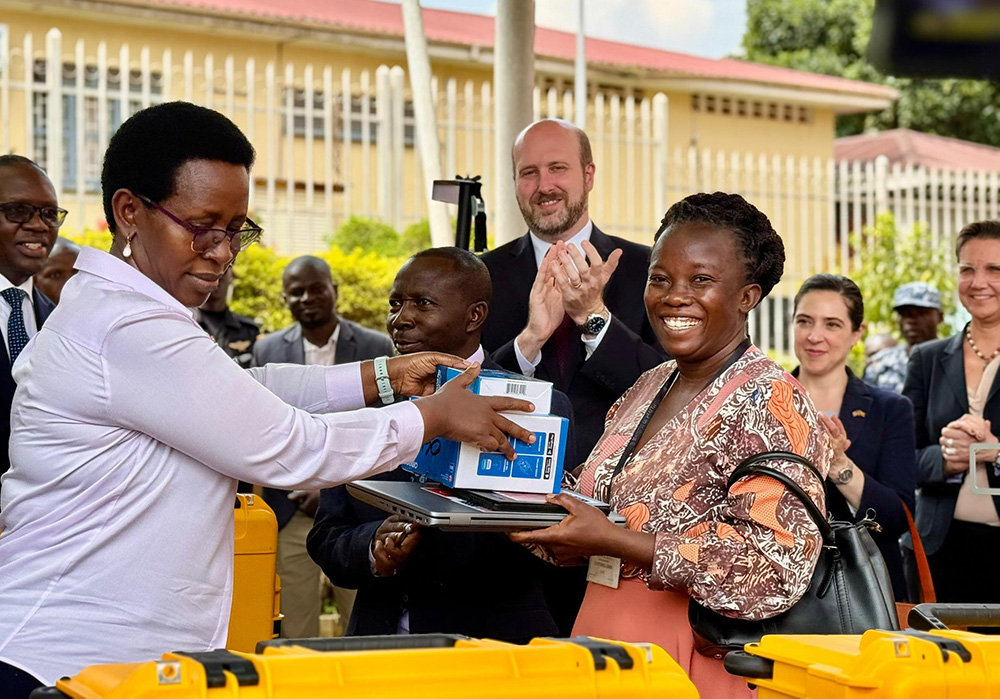 Ministry of Health Permanent Secretary Dr Diana Atwine handing over items for the mobile TB clinic trucks. Looking on is the US Ambassador in Uganda William Popp. (Courtesy photo)