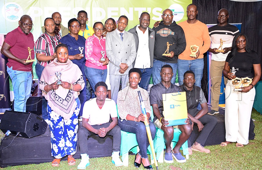 The outstanding players from the President's Cup tournament pose with their prizes alongside NCS Assisitant General Secretary-Techinical Milton Chebet and UGU president Jackson Were and Entebbe Club chairman Jacob Byamukama (standing center) after the tournament at Entebbe Club. Photo by Michael Nsubuga