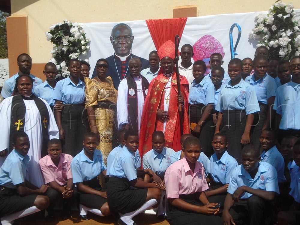 Bishop Prof. Grace Lubaale (C) with students of St. John's SS Wakitaka. (Credit: Charles Kakamwa)