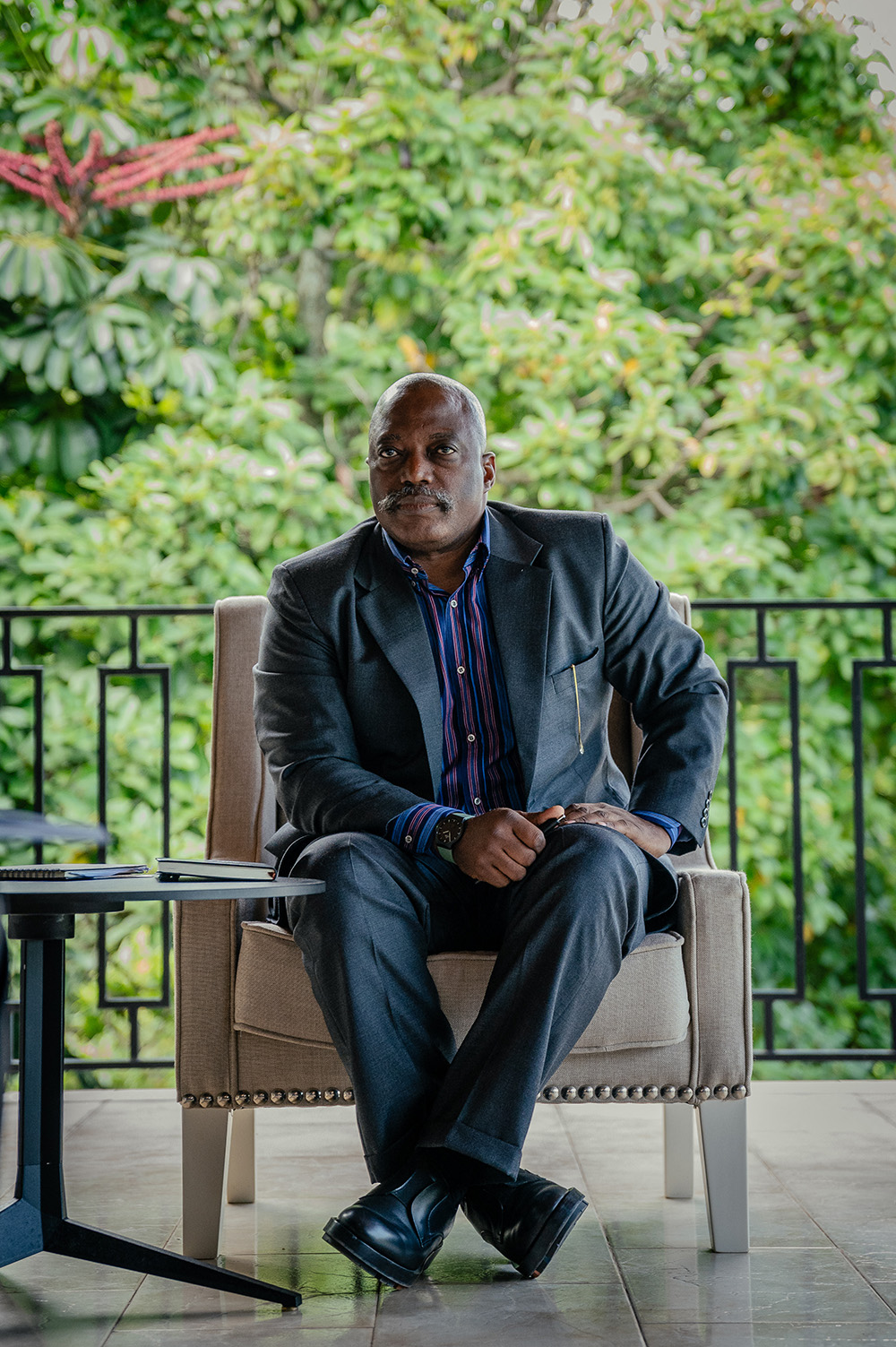 Former President of the Democratic Republic of Congo Joseph Kabila sits in an armchair during a meeting with leaders of various religious denominations at one of his residences in Goma on May 29, 2025. (Photo by Jospin Mwisha / AFP)