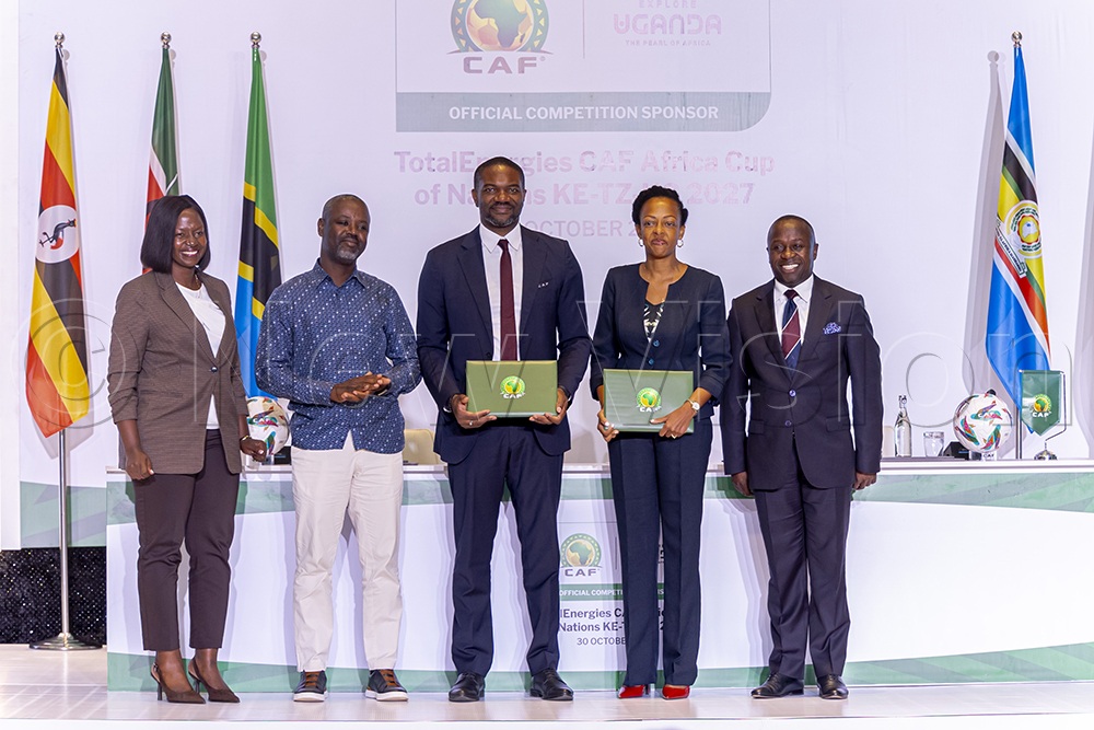 (L-R) Suzan Nakawuki, the Minister of State for Tourism, Thomas Tayebwa, the Deputy Speaker of Parliament, Samson Adamu, the CAF General Secretary, Juliana Kagwa, the UTB Chief Executive Officer, and Peter Ogwang, the Minister of State for Sports, during the signing of the AFCON deal between Uganda and CAF on Friday. (Credit: Julius Luwemba)