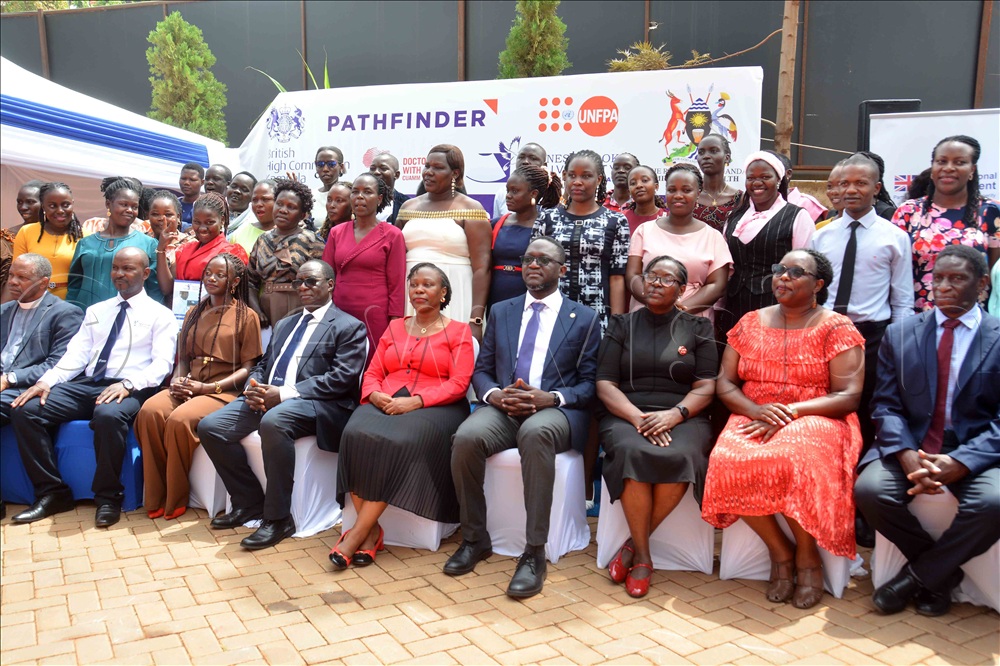 Health Advisor at the British High Commission Arnold Kabbale (seated fourth right) , the Vice Chancellor of Ernest Cook University Prof. Dr Michael Kawooya (seated fourth left), Dr Ritah Waddimba (seated fifth right), and the country director of Pathfinder pose for a group photograph with the graduates during the certificate award ceremony at the campus in Kampala on Thursday, October 15, 2026.