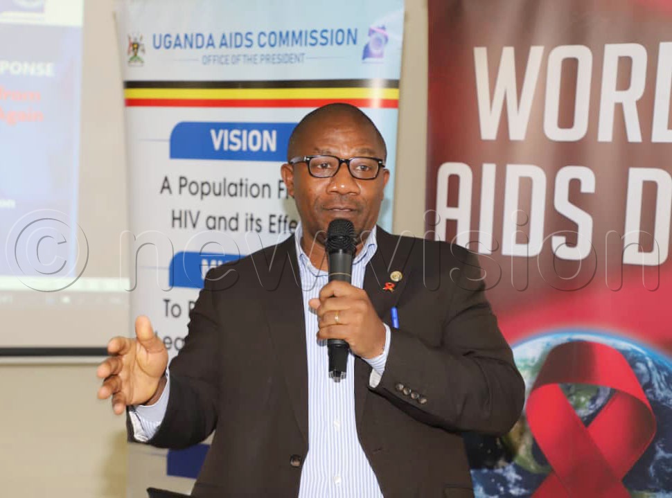 Dr Vincent Bagambe, the director Planning and Strategic Information Uganda AIDS Commission addressing journalists. (Photo by Agnes Kyotalengerire)