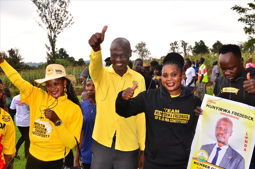 Fredrick Munyirwa with his supporters as they waited to take part in the election at Lubani Vocational Training center in Namagera town on Thursday.